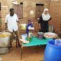 Volunteers prepare a meal for the residents of a South belt neighbourhood