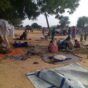 Villagers displaced by a surge of attacks squat on blankets and in hastily made tents in the village of Masteri in west Darfur, Ap phot