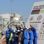 Workers take a photo during a ceremony marking the restarting of crude oil pumping at the Unity oil fields in South Sudan, Jan. 21, 2019. (Reuters photo)