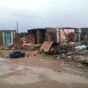 Homes reduced to rubble after flooding in Abu Hamad on August 12, 2024