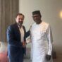 U.S.Envoy Tom Perriello shakes hands with Mohamed Ibn Chambas, Chair of the African Union Panel on Sudan in Geneva on August 13, 2024