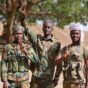 Sudanese troops flash victory signs after successfully repelling an RSF attack on Thursday, September 19th, 2024.