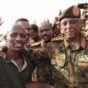 General al-Atta poses with troops as he inspects military positions in Kadaru in northern Khartoum Bahri on September 29, 2024