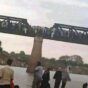 Civilians cross Al-Dinder Bridge heading to Gederaf after the REF control of the town on July 5, 2024