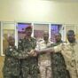 Abu Aqla Kikl (2nd from left) in Sudanese army uniform after his defection from the RSF.