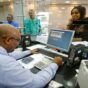 Customers making cash transactions at teller's windows at Bank of Khartoum. (file GettyImages)