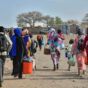 Civilians who fled the war-torn Sudan following the outbreak of fighting between the Sudanese army and the paramilitary Rapid Support Forces (RSF) walk at the Joda South border point, in Renk County, Upper Nile state, South Sudan April 30, 2023. (Reuters/Photo)