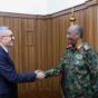 Lt Gen Abdel Fattah al-Burhan sshakes hands wit Turkish deputy FM Burhanettin Duran on Dec 4,2025