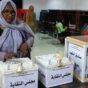 A Sudanese journalist casts her vote in the election of a syndicate leader and executive committee, after an absence of 33 years due to the dissolution of this body in 1989, at the Dar Al-Muhandis in the capital Khartoum, on August 27, 2022. (Photo by ASHRAF SHAZLY / AFP)