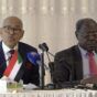 Sudan FM Hussein Awad (L) and Information Minister Graham Abdel Qadir speak to the media in Port Sudan on October 14, 2024