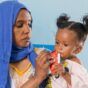 Eleven-month-old Yadin nibbles on ready-to-use therapeutic food (RUTF) in Sudan. (UNICEF photo)