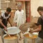 Young men participate in the collective kitchen in Omdurman July 24, 2024