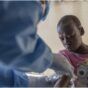 A health worker attends to a mpox patient, at a treatment centre in Munigi, eastern Congo, Monday, Aug. 19, 2024