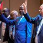 Hamdok and some of Tagadum leaders raise their hands at the opening session of their three-day meeting on May 27, 2024